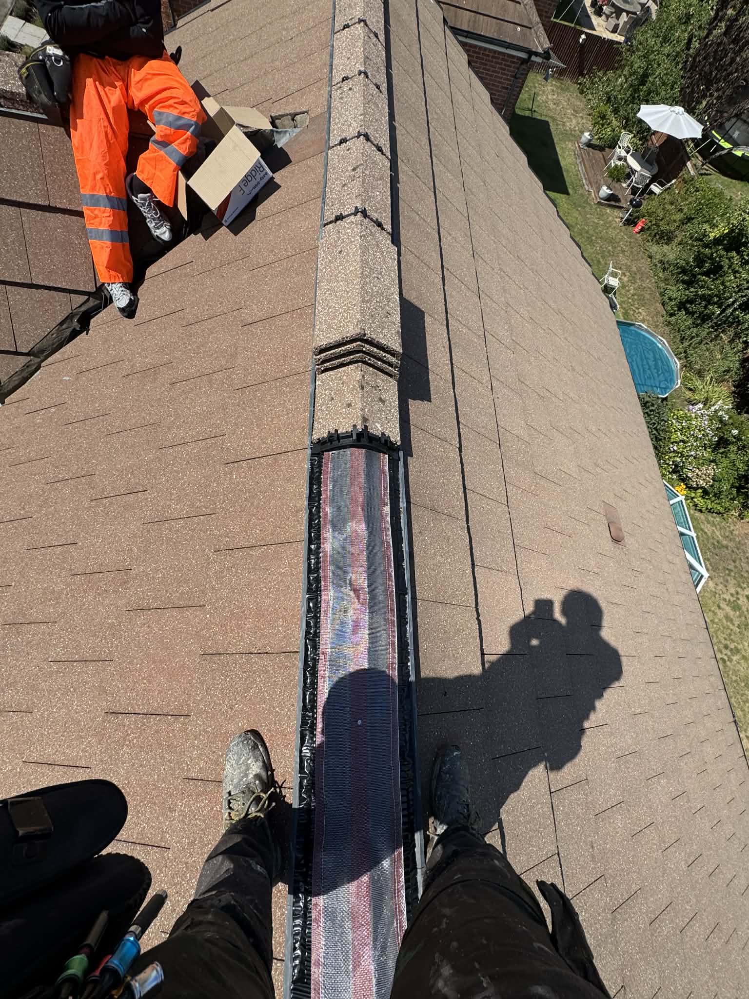 Ridge re-bedding and repointing throughout